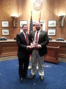 Senator Barrasso receiving National Leadership Award from Domenic Bravo, President NASORLO